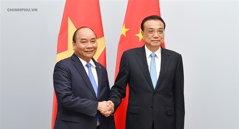 ASEM 12: 阮春福总理会见中国国务院总理李克强