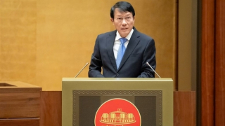 Minister Luong Tam Quang presents report on four draft laws to National Assembly