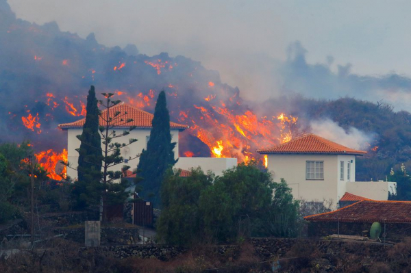 Thousands flee as volcano erupts on Spain's La Palma island, homes destroyed -0