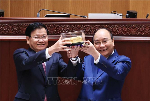 Chủ tịch nước: Quan hệ Việt-Lào sẽ tiếp tục nở hoa thơm, kết trái ngọt -0