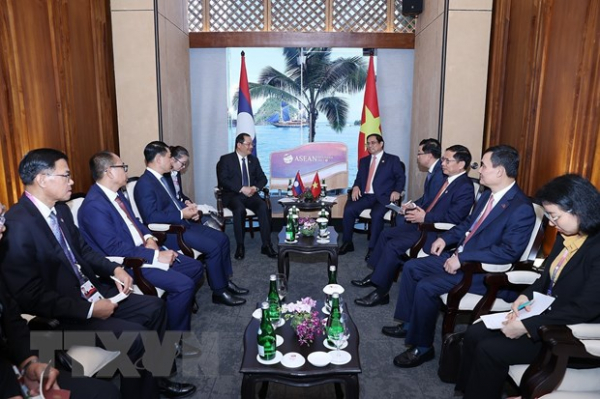 Thủ tướng Phạm Minh Chính gặp Thủ tướng Lào Sonexay Siphandone -0