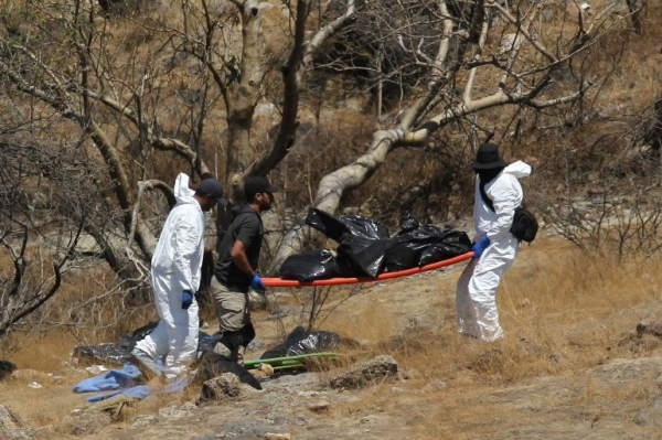 Phát hiện ra nhiều túi đựng xác người dưới hẻm núi ở Mexico  -0