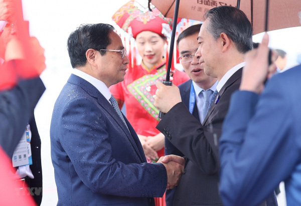 Thủ tướng bắt đầu dự Hội chợ CAEXPO và Hội nghị CABIS ở Trung Quốc -0
