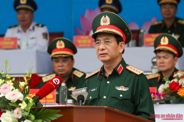 Minister Phan Van Giang and Minister To Lam review rehearsal of armed forces parade in celebration of Dien Bien Phu Victory -0