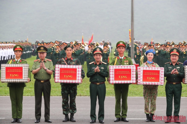 Minister Phan Van Giang and Minister To Lam review rehearsal of armed forces parade in celebration of Dien Bien Phu Victory -0
