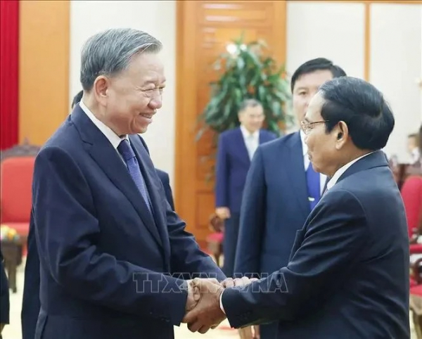 Vietnam always supports Laos in implementing development goals: Party chief -0