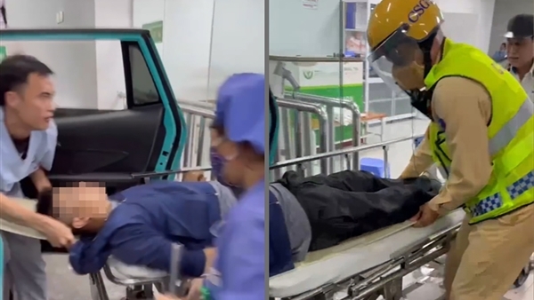 CSGT mở lối cho taxi vượt tắc đường cứu hai người bị tai nạn lao động