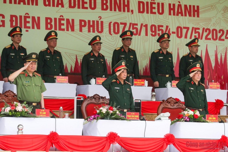 Minister Phan Van Giang and Minister To Lam review rehearsal of armed forces parade in celebration of Dien Bien Phu Victory -0
