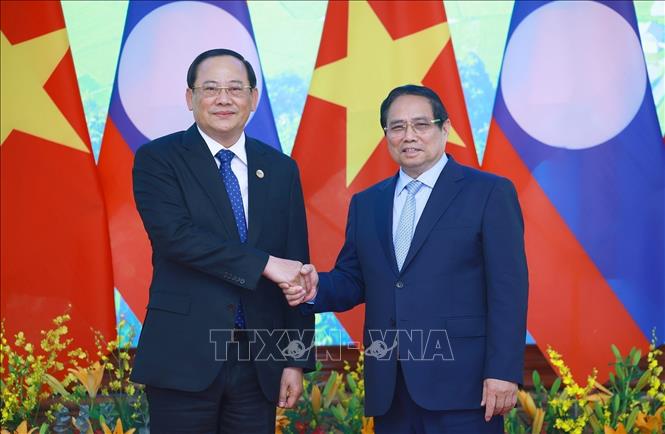 Thủ tướng Phạm Minh Chính gặp Thủ tướng Lào Sonexay Siphandone nhân Hội nghị thượng đỉnh P4G -0