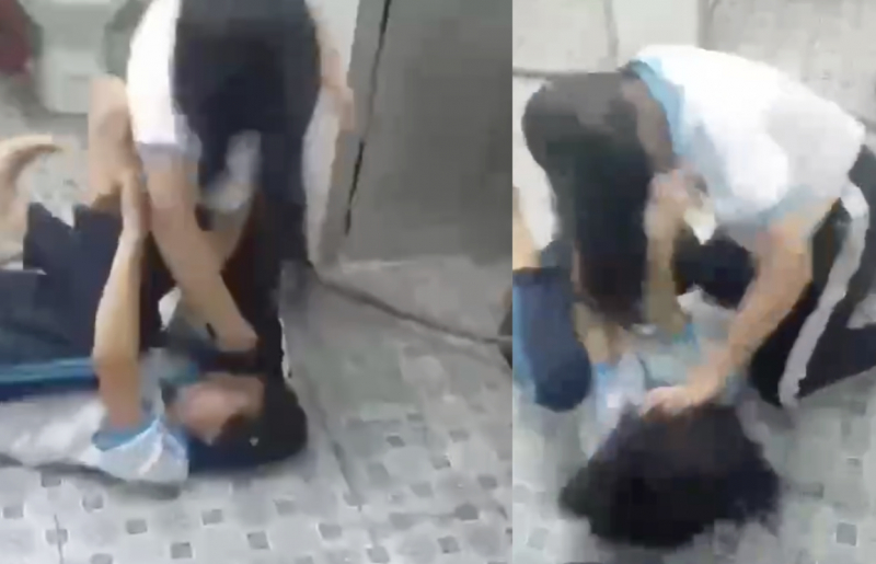 Disciplinaire maatregelen tegen 2 vrouwelijke studenten die vochten en de studenten die toekeken -0