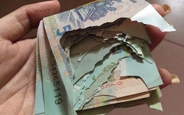 Đổi tiền rách, hỏng không phải trình giấy tờ -0